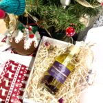 firming luxury body oil into a christmas box with minimalistic packaging